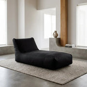 Sittsäck dagbädd sunbed 90 OX Blue in a minimalist, sunlit living room with a jute rug and wooden floor lamp.