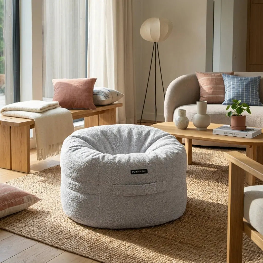 Barnfåtölj Roll 80 Madu Light Grey in a cozy, modern living room setting with textured fabric and neutral decor.