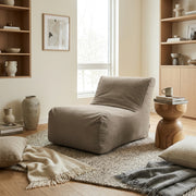 Sittsäck Lounge 100 OX Grey in a minimalist living room with a jute rug, neutral decor, and natural light.